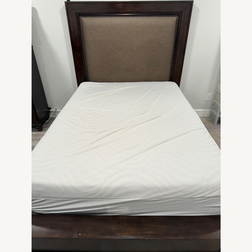 Used Wooden Upholstered Bed  for sale on AptDeco