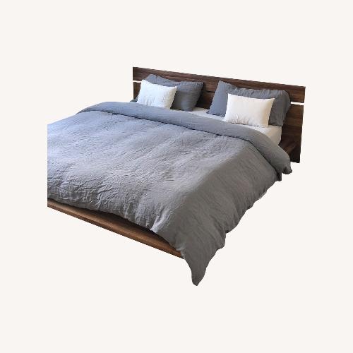 Used ABC Carpet & Home Teak King Bed for sale on AptDeco
