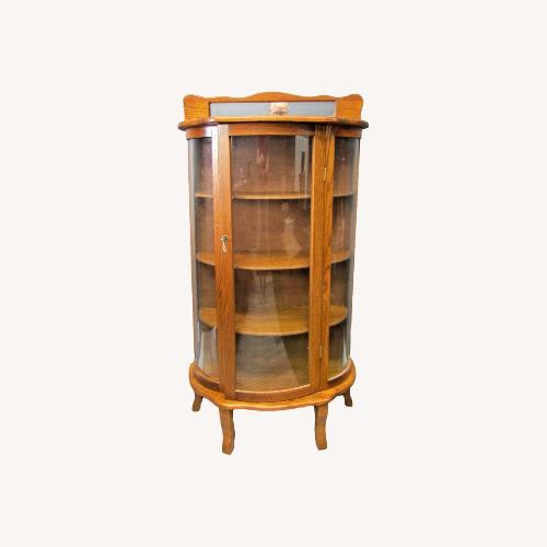Used Antique Tiger Oak Curved Glass Curio Cabinet for sale on AptDeco