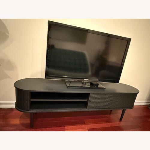 Used Modern Black TV Stand  W Storage for sale on AptDeco