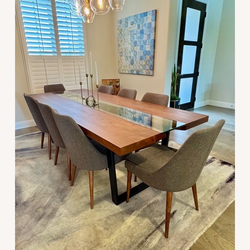 Used Modani Wood Dining Table with 8 Chairs for sale on AptDeco