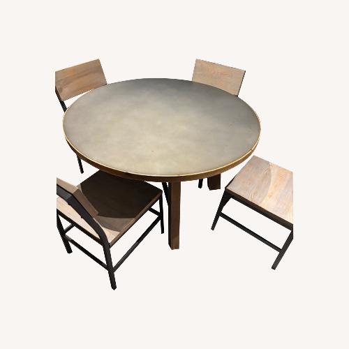Used RH Zinc Trestle Round Dining Table for sale on AptDeco