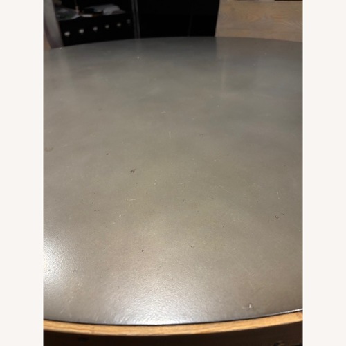 Used RH Zinc Trestle Round Dining Table for sale on AptDeco