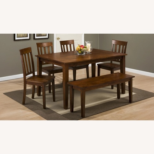 Used Raymour & Flanigan Dining Room Table and Chairs for sale on AptDeco