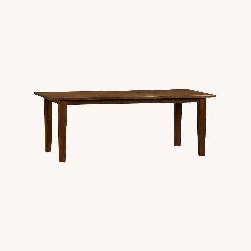 Used Crate & Barrel Basque Honey Brown Solid Wood Table for sale on AptDeco