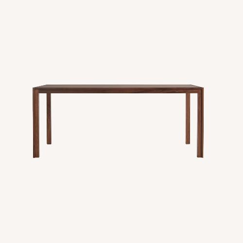 Used Herman Miller Doubleframe Walnut Dining Table  for sale on AptDeco