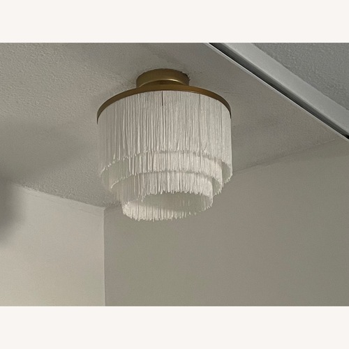 Used Fringe Chandelier with Brushed Gold Base for sale on AptDeco