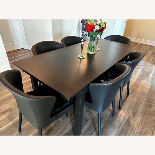 Used IKEA Black Wood Dining Table for sale on AptDeco