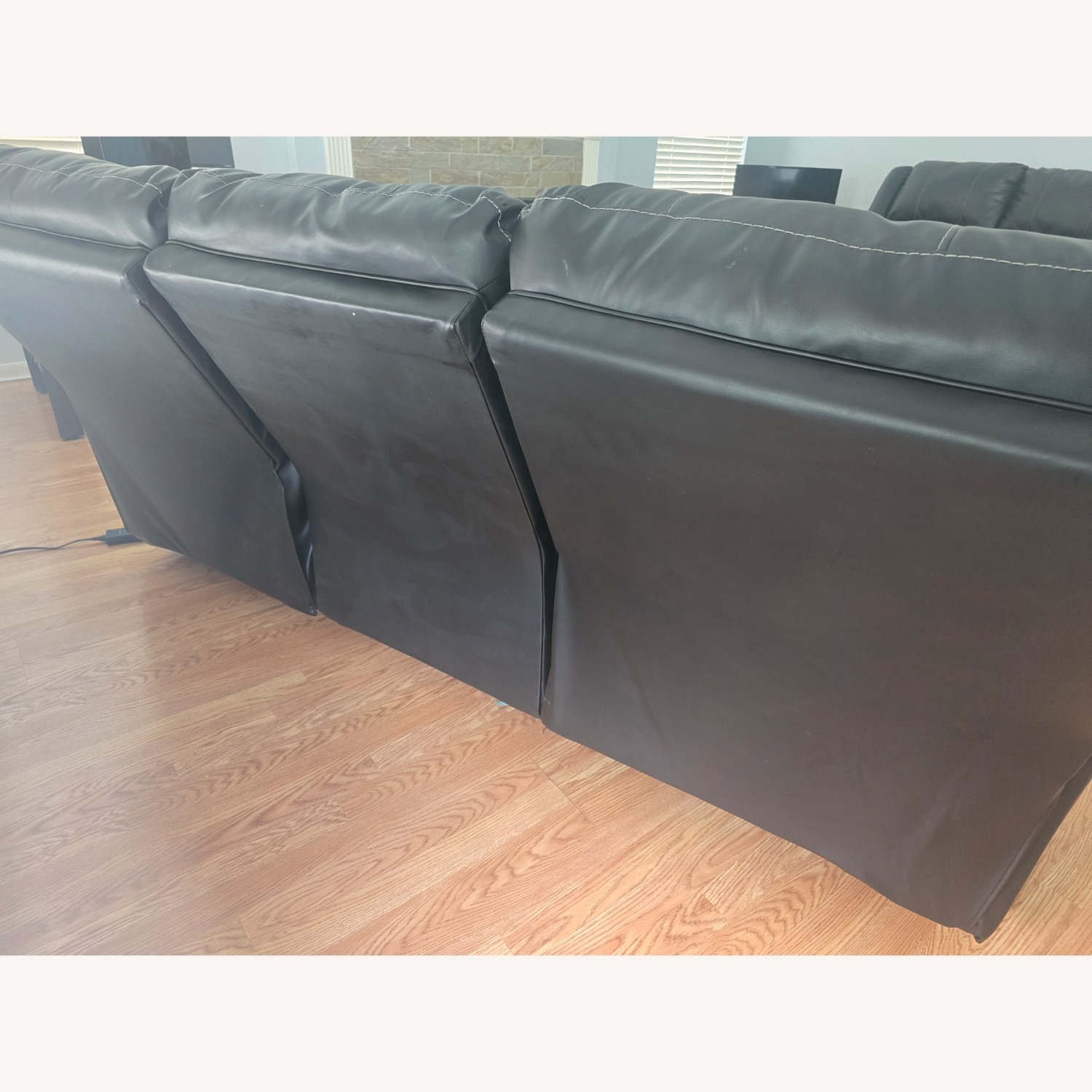 Calderwell Black Faux Leather Sofa - image-4