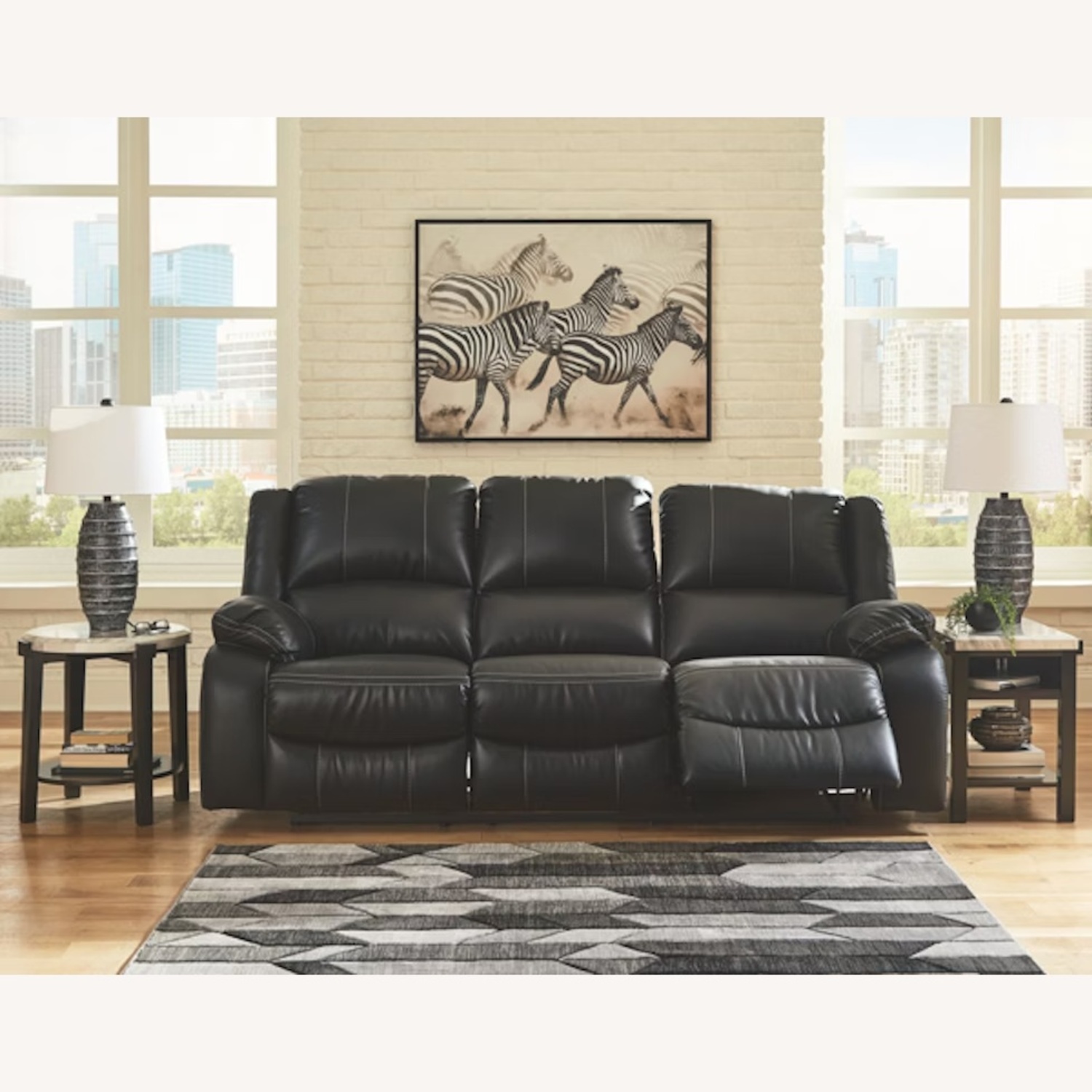 Calderwell Black Faux Leather Sofa - image-0