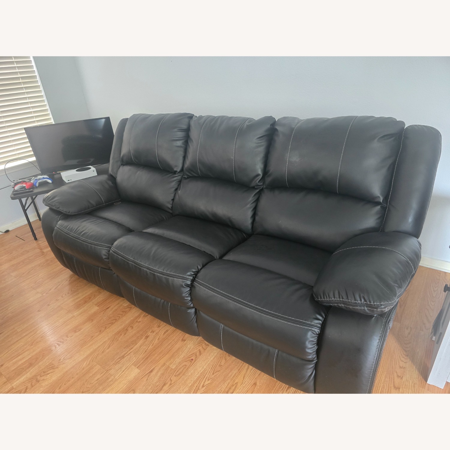 Calderwell Black Faux Leather Sofa - image-1