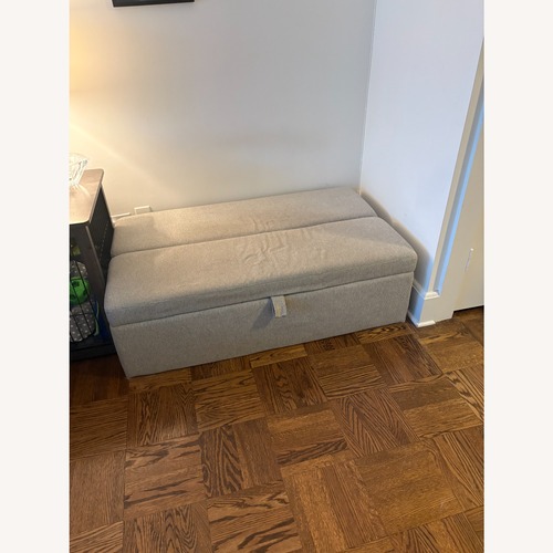 Used Storage Ottoman that opens to a Twin Sized Bed for sale on AptDeco