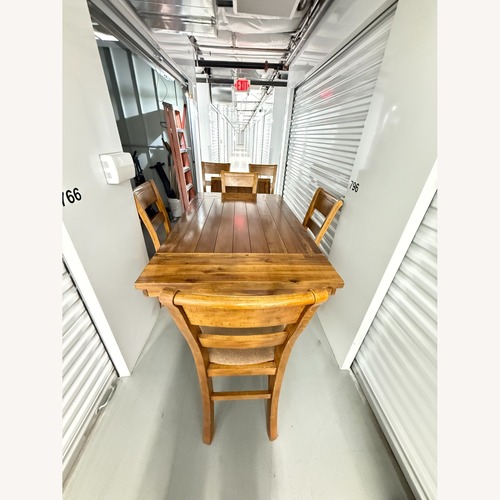 Used Wooden Dining Set With Ladder Back Chairs for sale on AptDeco