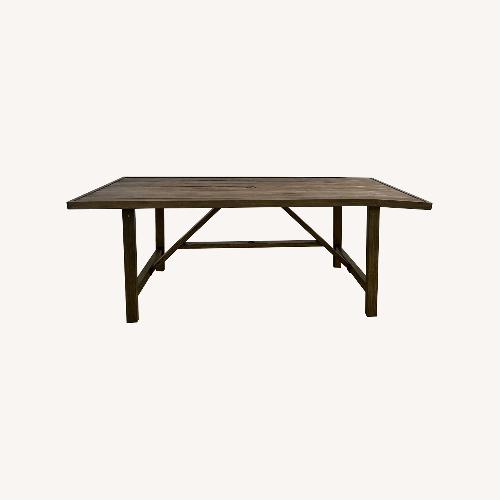 Used Trestle Outdoor Dining Table for sale on AptDeco