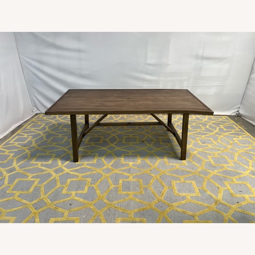 Used Trestle Outdoor Dining Table for sale on AptDeco