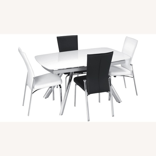 Used Raymour & Flanigan Glass Dining Table for sale on AptDeco