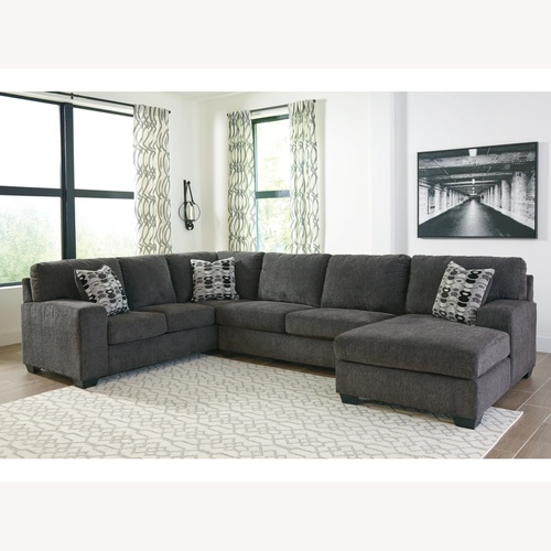 Used Ballinasloe Grey Sectional With Ottoman Storage  for sale on AptDeco