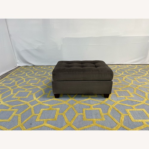 Used Dark Gray Tufted Ottoman for sale on AptDeco