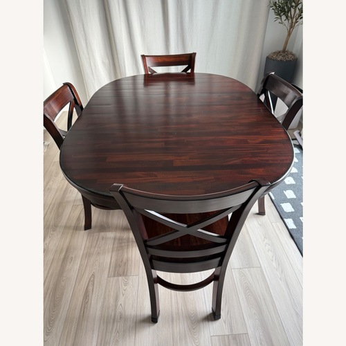 Used Solid Wood Dining Table With Leaf and 4 Chairs for sale on AptDeco