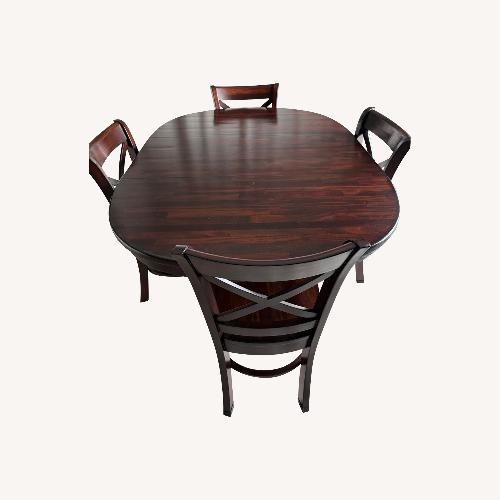 Used Solid Wood Dining Table With Leaf and 4 Chairs for sale on AptDeco