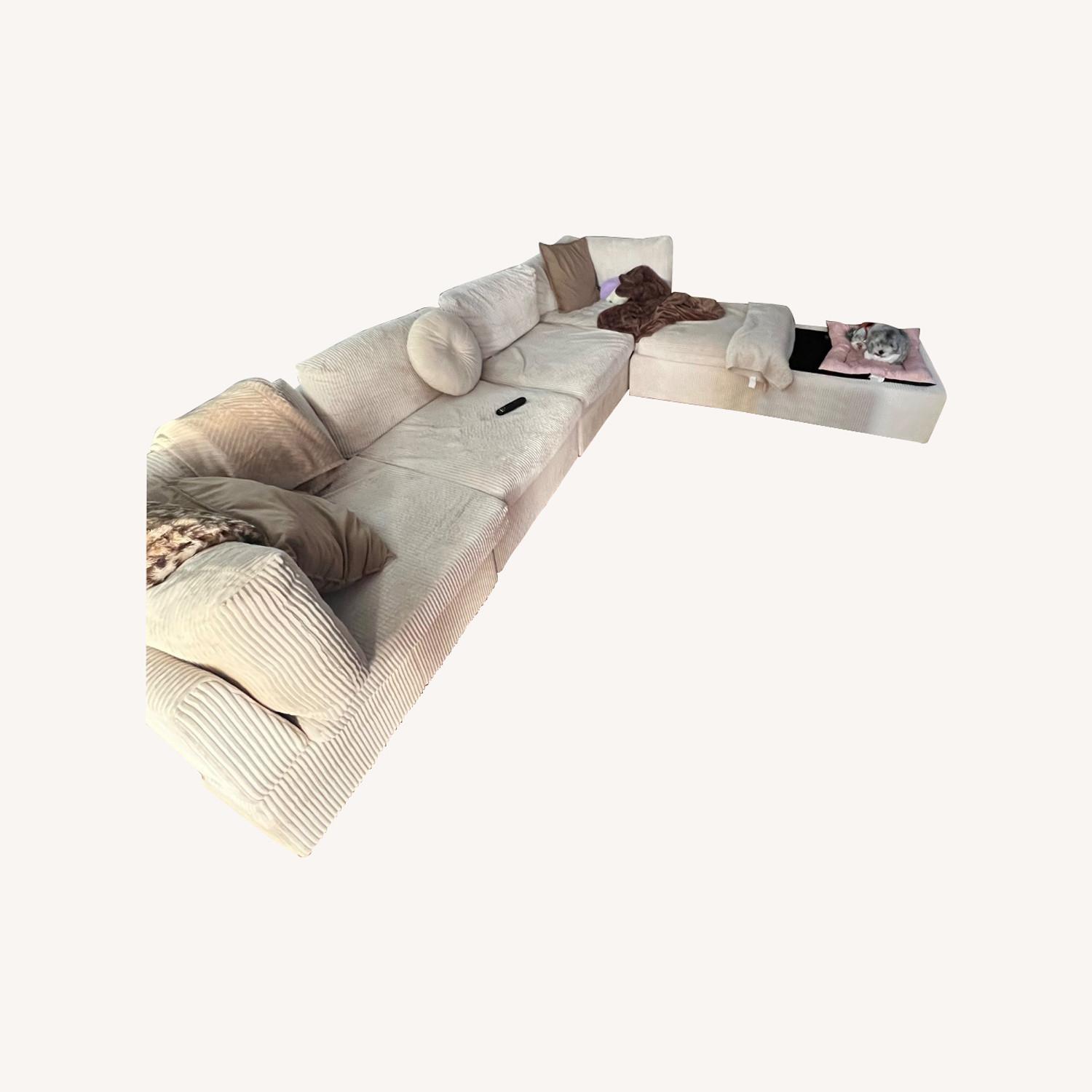 Annai 129" Wide Reversible Modular Corner Sectional with Ottoman - image-0