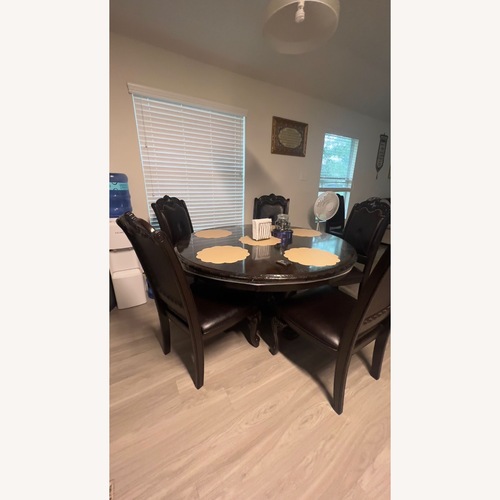Used Dark Brown Wood Dining Set for sale on AptDeco