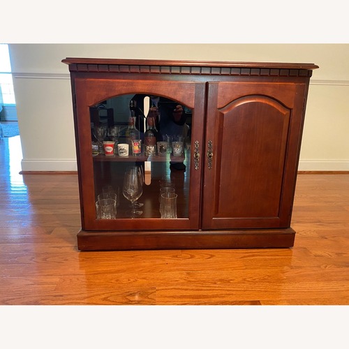 Used Cherry Wood Mobile TV Console for sale on AptDeco