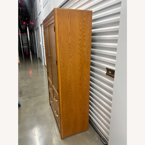 Used Mid-Century Wooden Armoire with Brass Hardware for sale on AptDeco