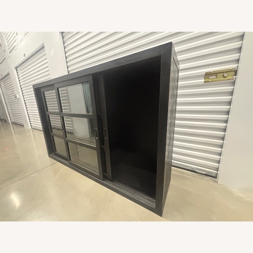 Used Industrial Black Cabinet with Sliding Glass Doors for sale on AptDeco