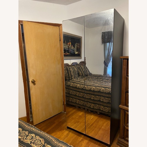 Used Black Glass Armoire for sale on AptDeco