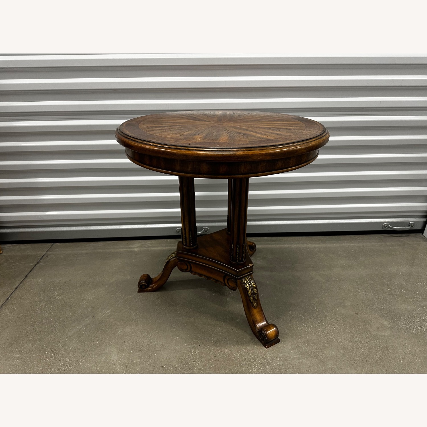 Traditional Round Accent Table with Carved Details - image-0