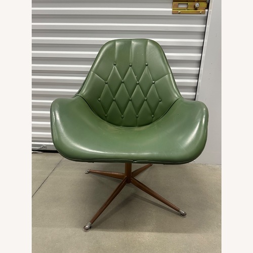 Used Mid-Century Green Vinyl Swivel Lounge Chair for sale on AptDeco