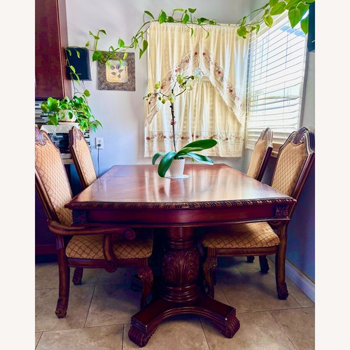 Used Extendable & Shortening Wooden Dining Table Set for sale on AptDeco