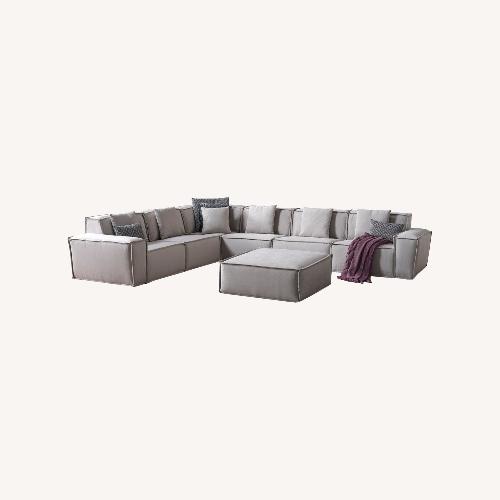 Used Modern Cream 7-Piece Sectional with Ottoman for sale on AptDeco
