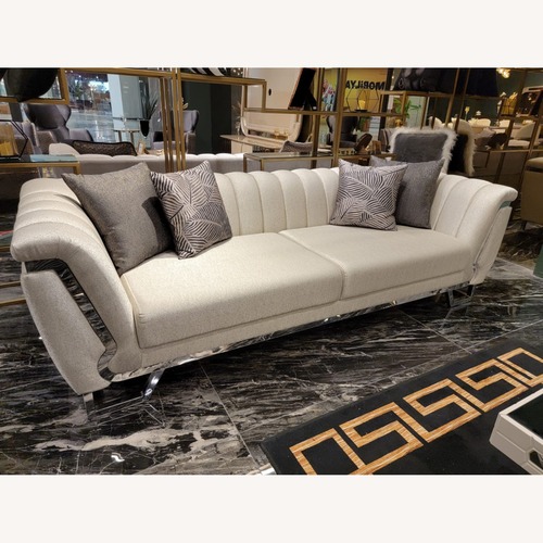 Used Roma Cream Modern Sofa with Gold Accents for sale on AptDeco