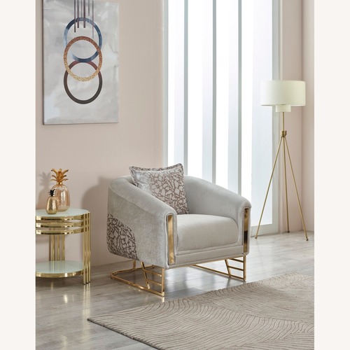 Used  Luxury Cream Accent Chair with Gold Base for sale on AptDeco