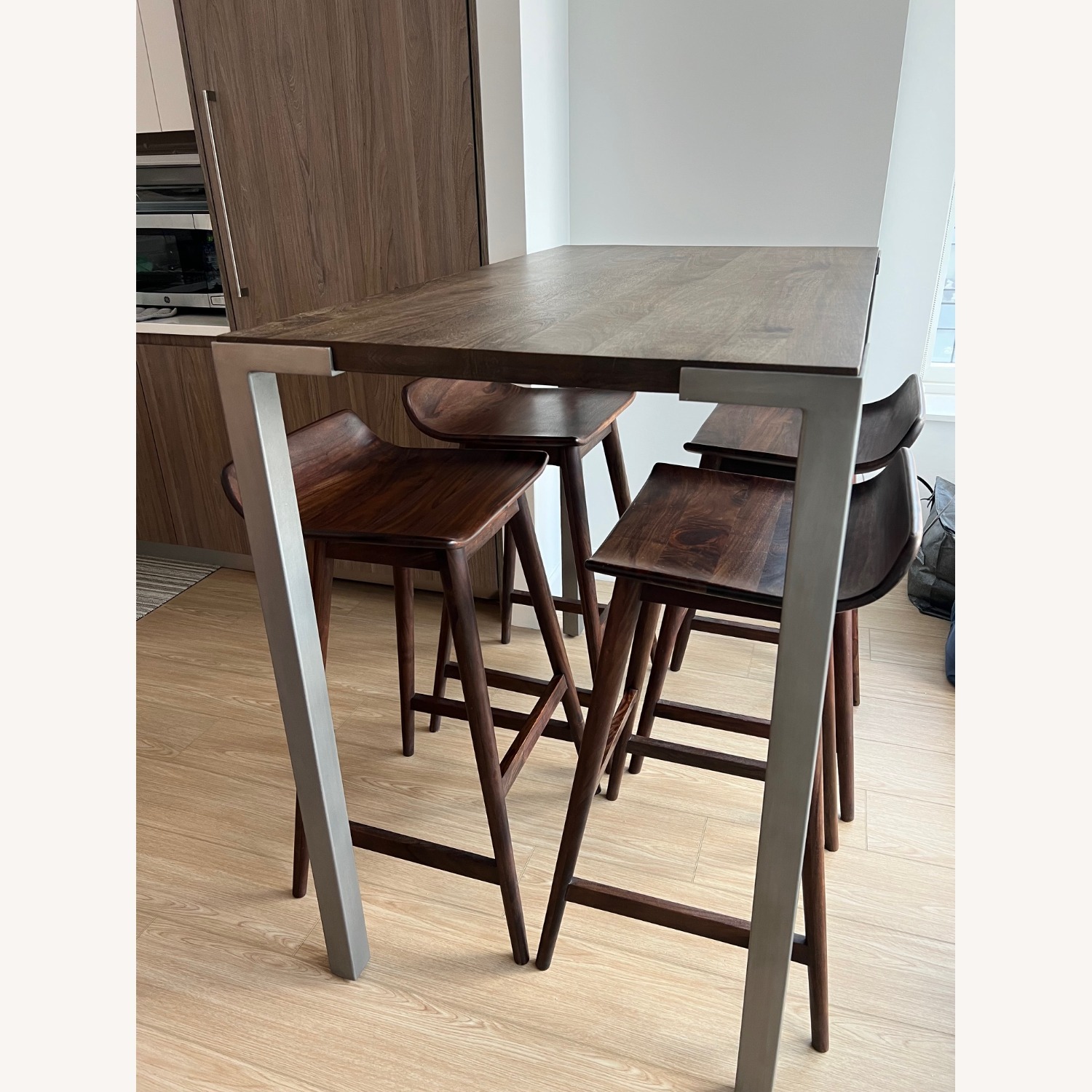 CB2 Stilt Dark Brown Wood Dining Set - image-1