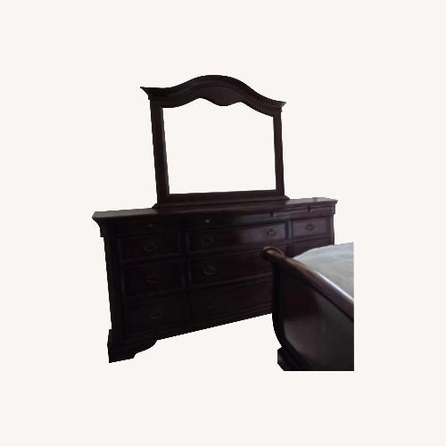 Used Raymour & Flanigan Dark Brown Wood Dresser for sale on AptDeco