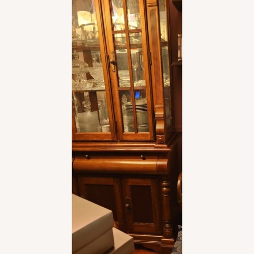 Used Raymour & Flanigan Dark Brown Wood China Cabinet   for sale on AptDeco