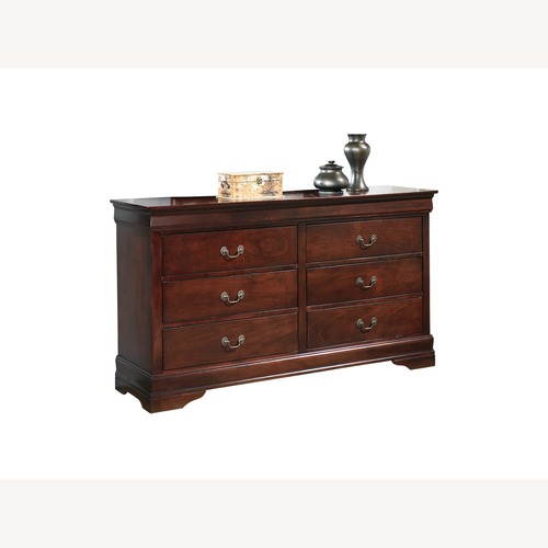 Used Wooded 6 Drawer Dresser and 2 Nightstands for sale on AptDeco