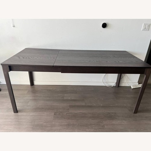 Used IKEA Dark Brown Wood Dining Table for sale on AptDeco