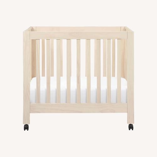 Used Babyletto Origami Mini Crib Natural Wood Crib for sale on AptDeco