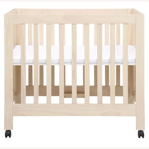 Used Babyletto Origami Mini Crib Natural Wood Crib for sale on AptDeco