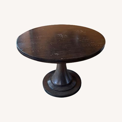 Used Dark Brown Wood Dining Table for sale on AptDeco