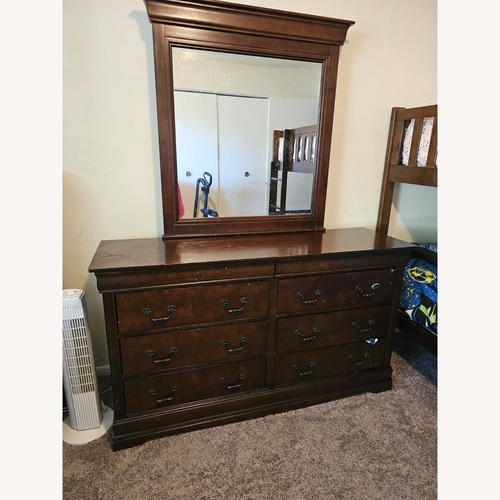 Used Value City Furniture Dark Brown Wood Dresser for sale on AptDeco