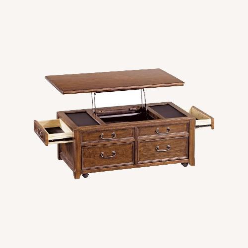 Used Ashley Woodboro Lift Top Wood Coffee Table for sale on AptDeco
