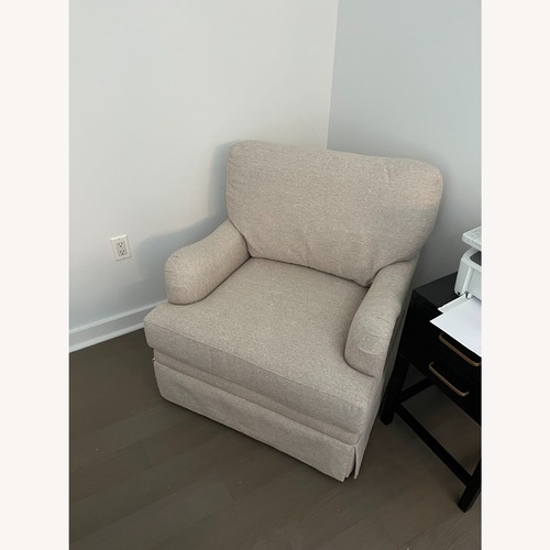 Used Skirted Swivel Arm Chair for sale on AptDeco
