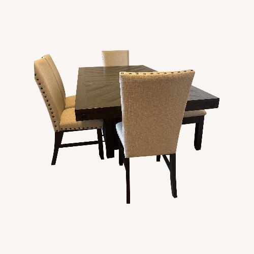 Used Dark Brown Wood Dining Table for sale on AptDeco