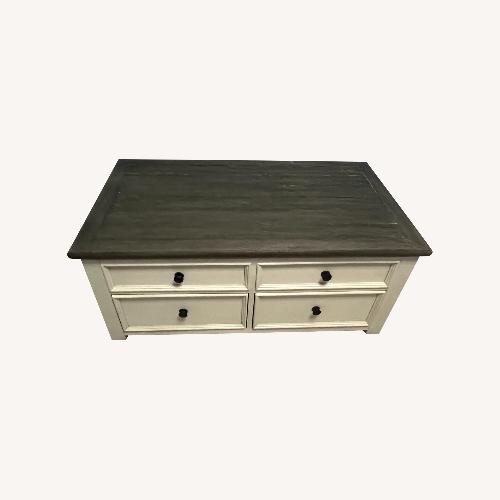 Used Ashley Bolanburg Wood Lift Top Coffee Table - Four Drawers for sale on AptDeco