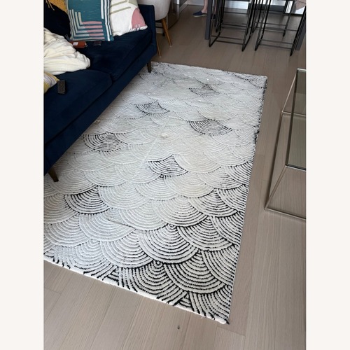 Used CB2 Flutter White Wool Area Rug 5' x 8' for sale on AptDeco